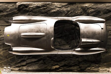 Ferrari Testa Rossa J Sculpture mounted on wall behind bar