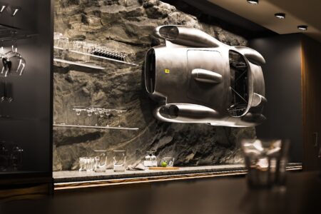 Ferrari Testa Rossa J Sculpture mounted on wall behind bar