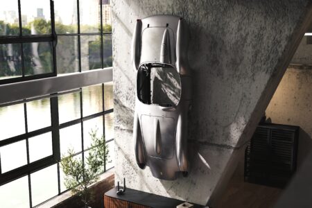 Ferrari Testa Rossa J Sculpture mounted on wall in loft building