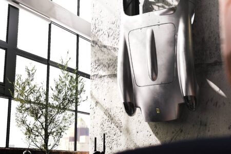 Ferrari Testa Rossa J Sculpture mounted on wall in loft building